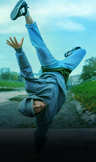 Breakdance performer, upside down motion on street